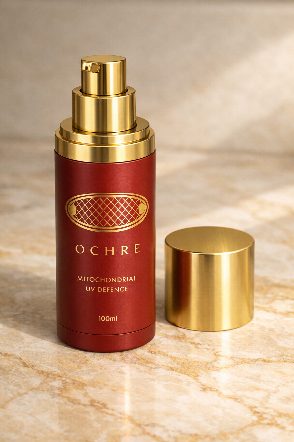 OCHRE 100ml airless pump dispenser — red oxide, angled view